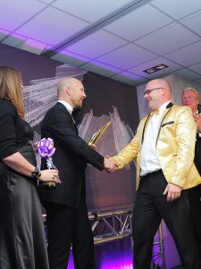 Award winner shaking hands with Matt Dawson